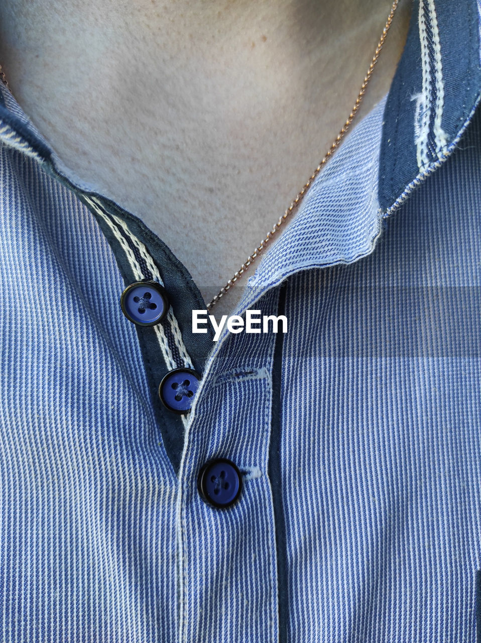 Cropped photo of mans button up shirt