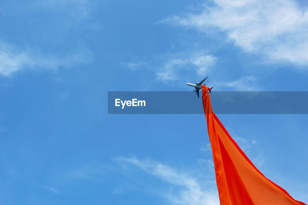 Low angle view of flag against sky