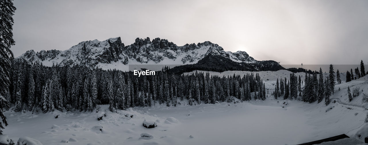 Scenic view of snow covered mountains against sky