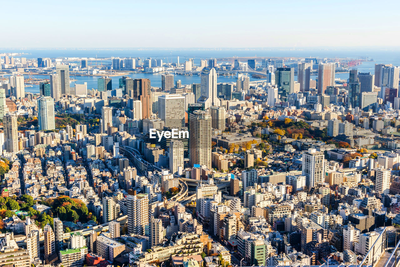 High angle view of city buildings against sky