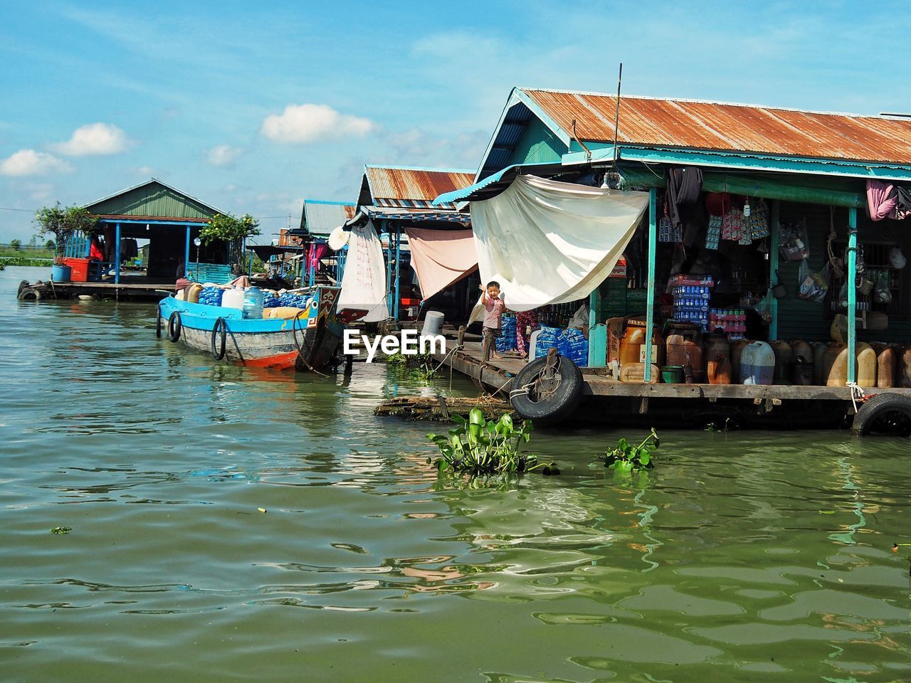 MAN ON BOAT IN WATER