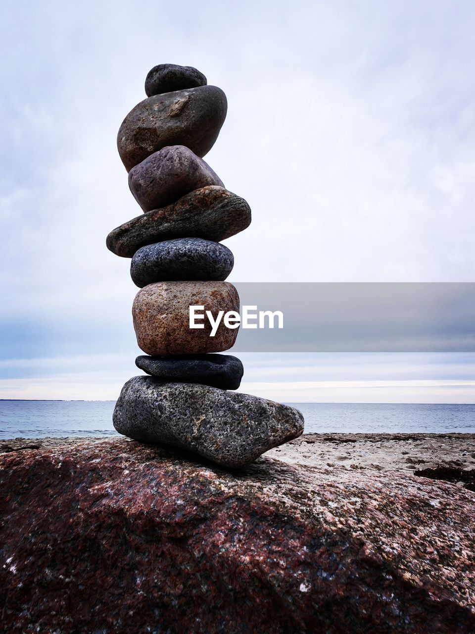 rock, balance, sea, sky, zen-like, pebble, water, beach, stone, land, nature, coast, tranquility, shore, sand, cloud, ocean, beauty in nature, tranquil scene, no people, scenics - nature, horizon over water, horizon, outdoors, day, stability, blue, body of water, coastline