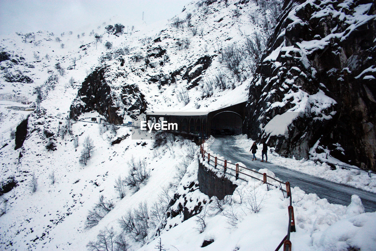 SNOW COVERED HOUSES ON MOUNTAIN