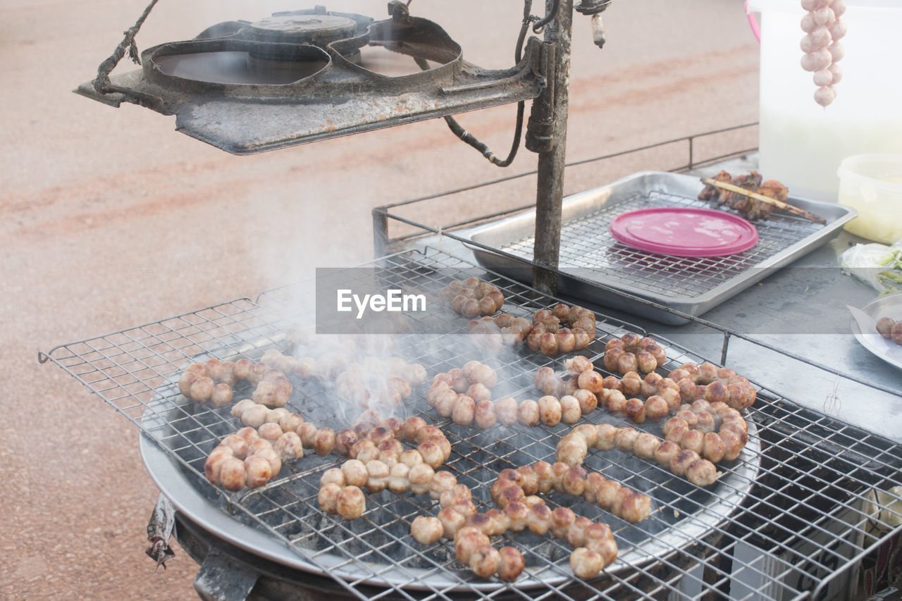 High angle view of meat on barbecue grill