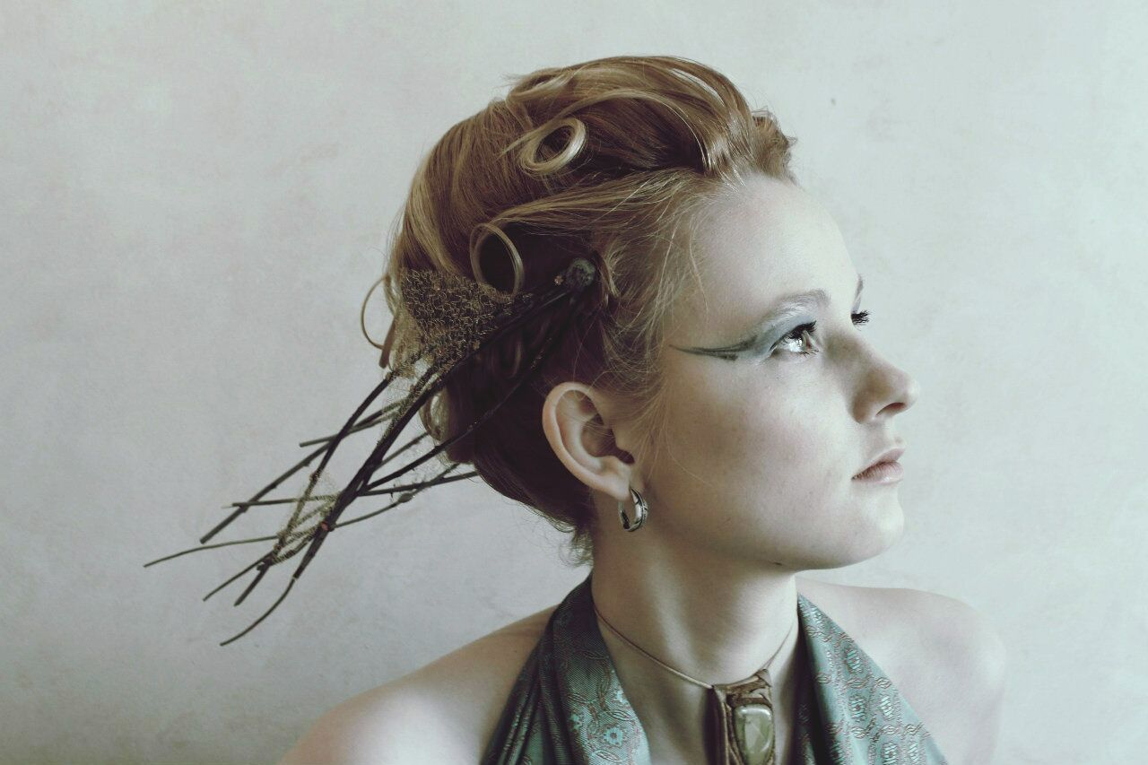 Close-up of thoughtful young woman against wall