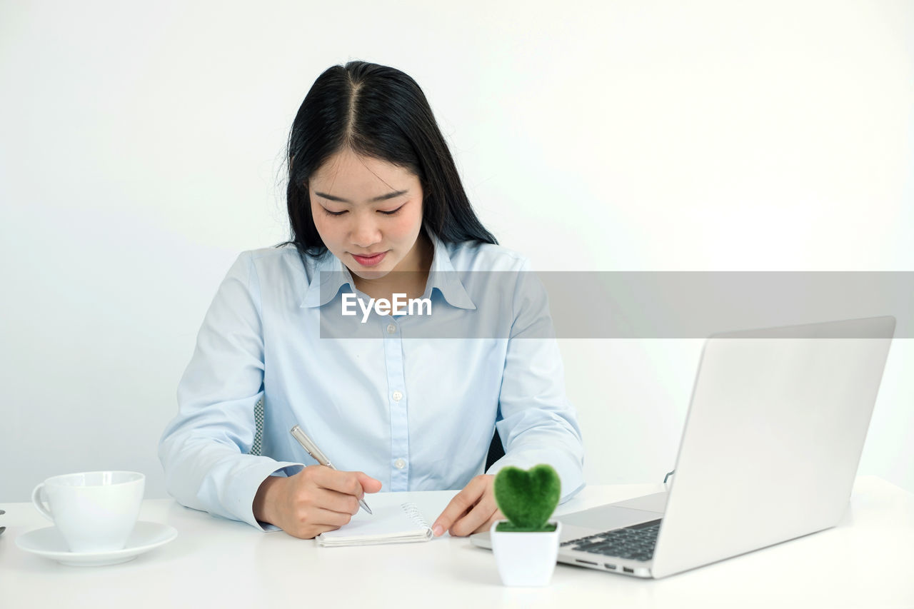 portrait of businesswoman working at desk