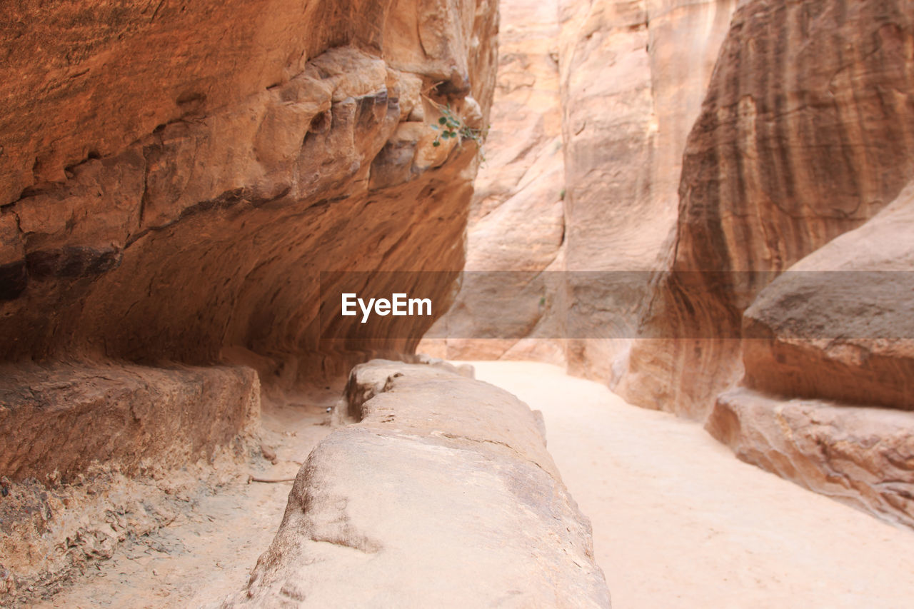 Walkway amidst rock formations at petra