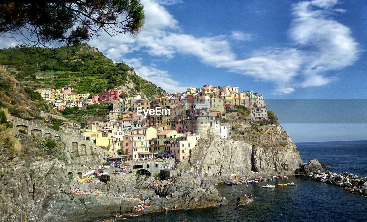 Panoramic view of townscape by sea against sky