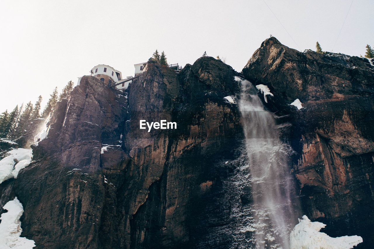 Scenic view of rocky mountains against clear sky