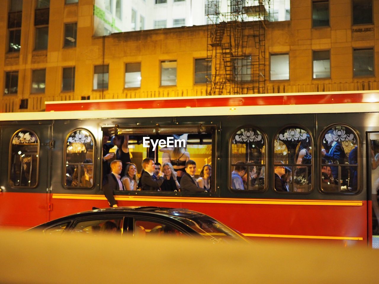 PEOPLE IN BUS AGAINST CITY