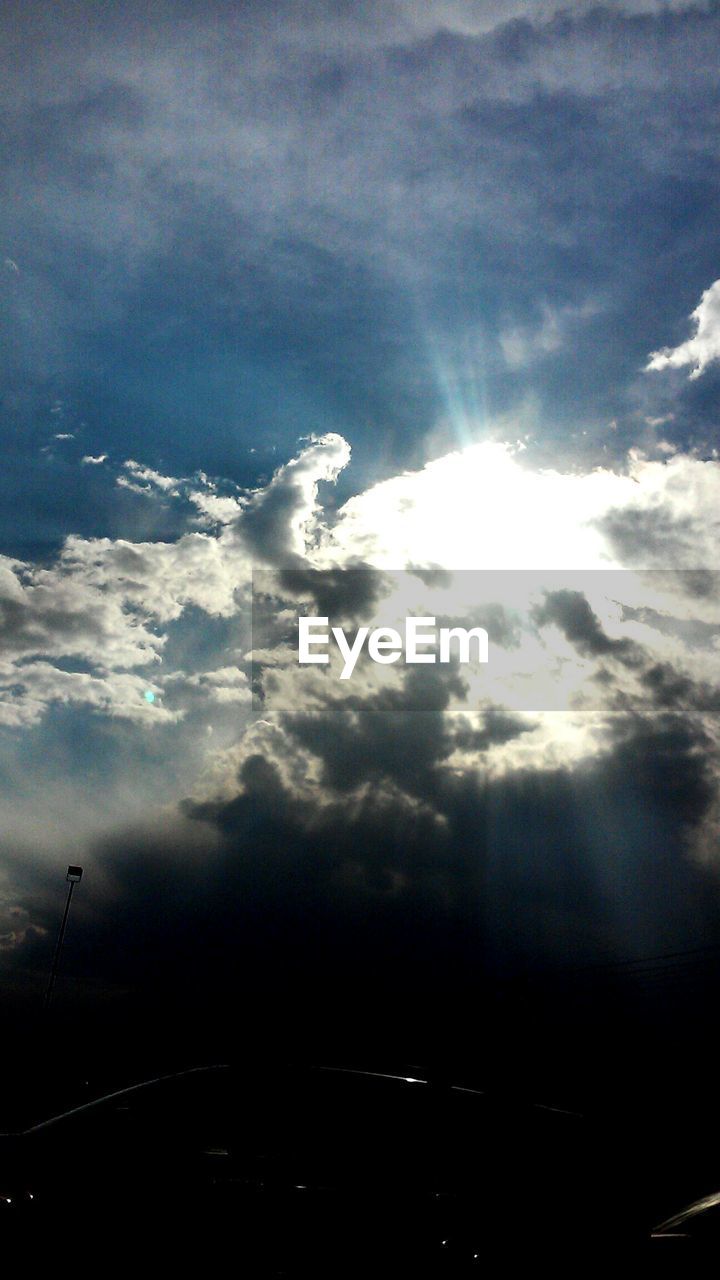 SCENIC VIEW OF MOUNTAINS AGAINST CLOUDY SKY