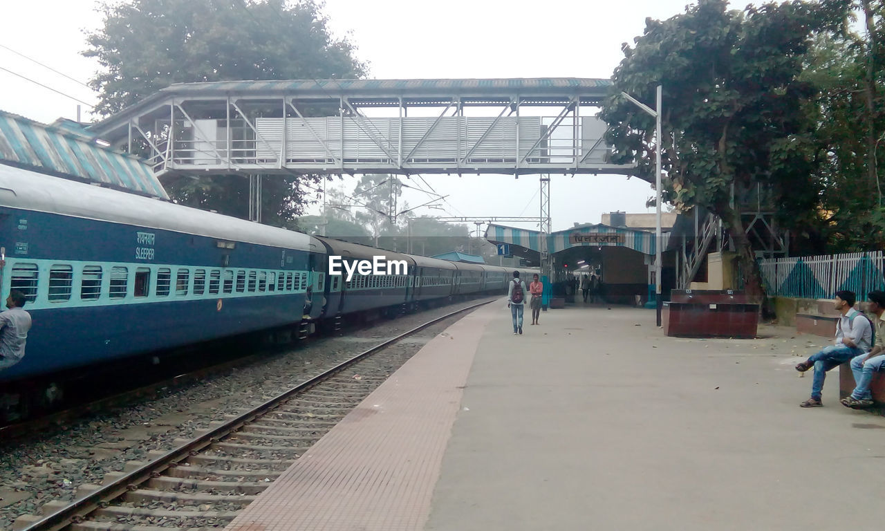 TRAIN IN RAILROAD STATION PLATFORM