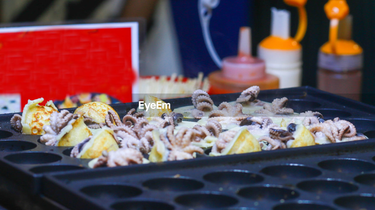 Takoyaki being prepared in ho thi ky street food, ho chi minh city