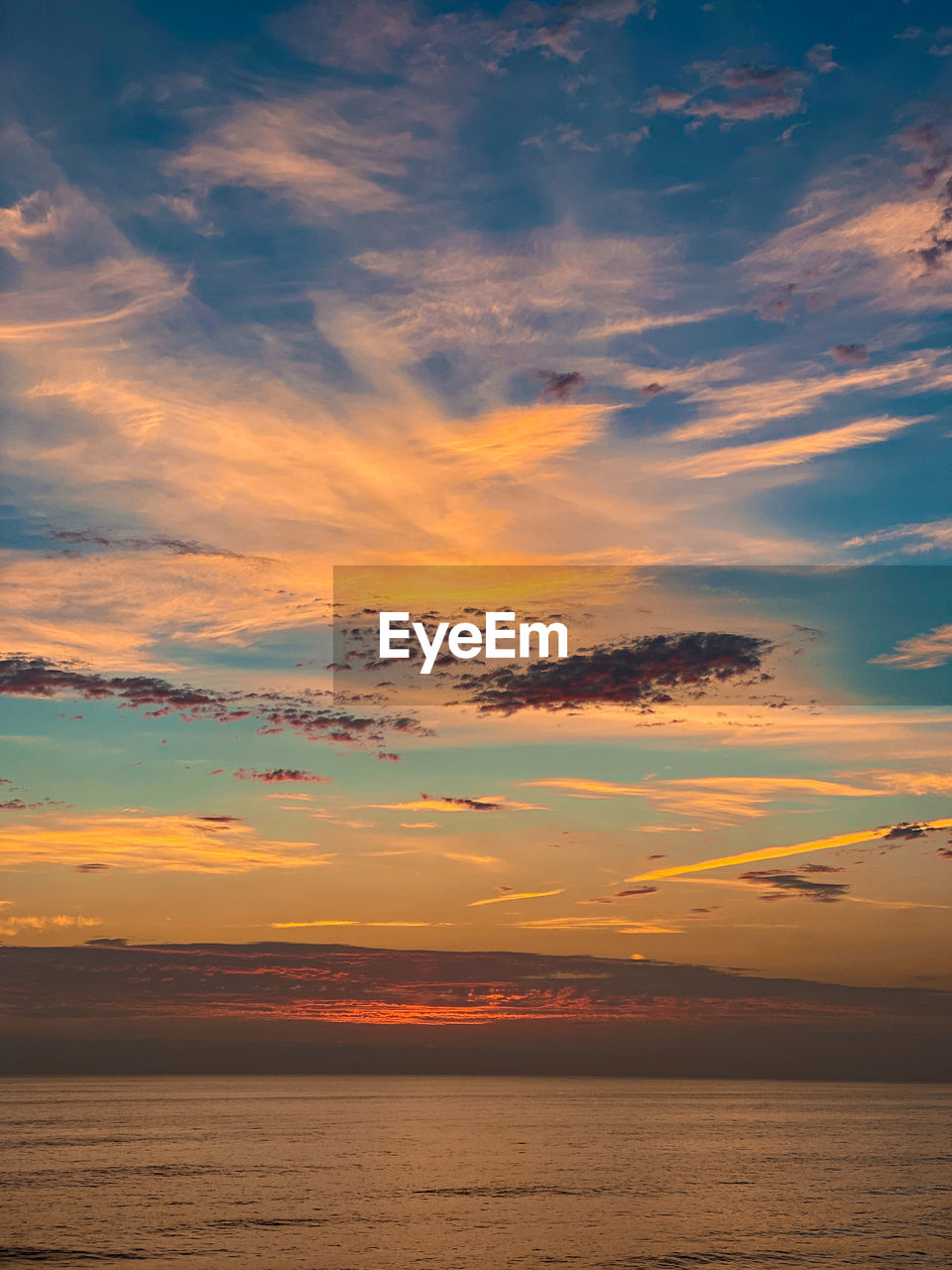 Beautiful dramatic sunset over ocean with clouds in del mar, california.