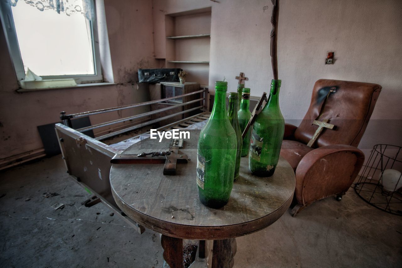 EMPTY BOTTLES ON TABLE AT HOME