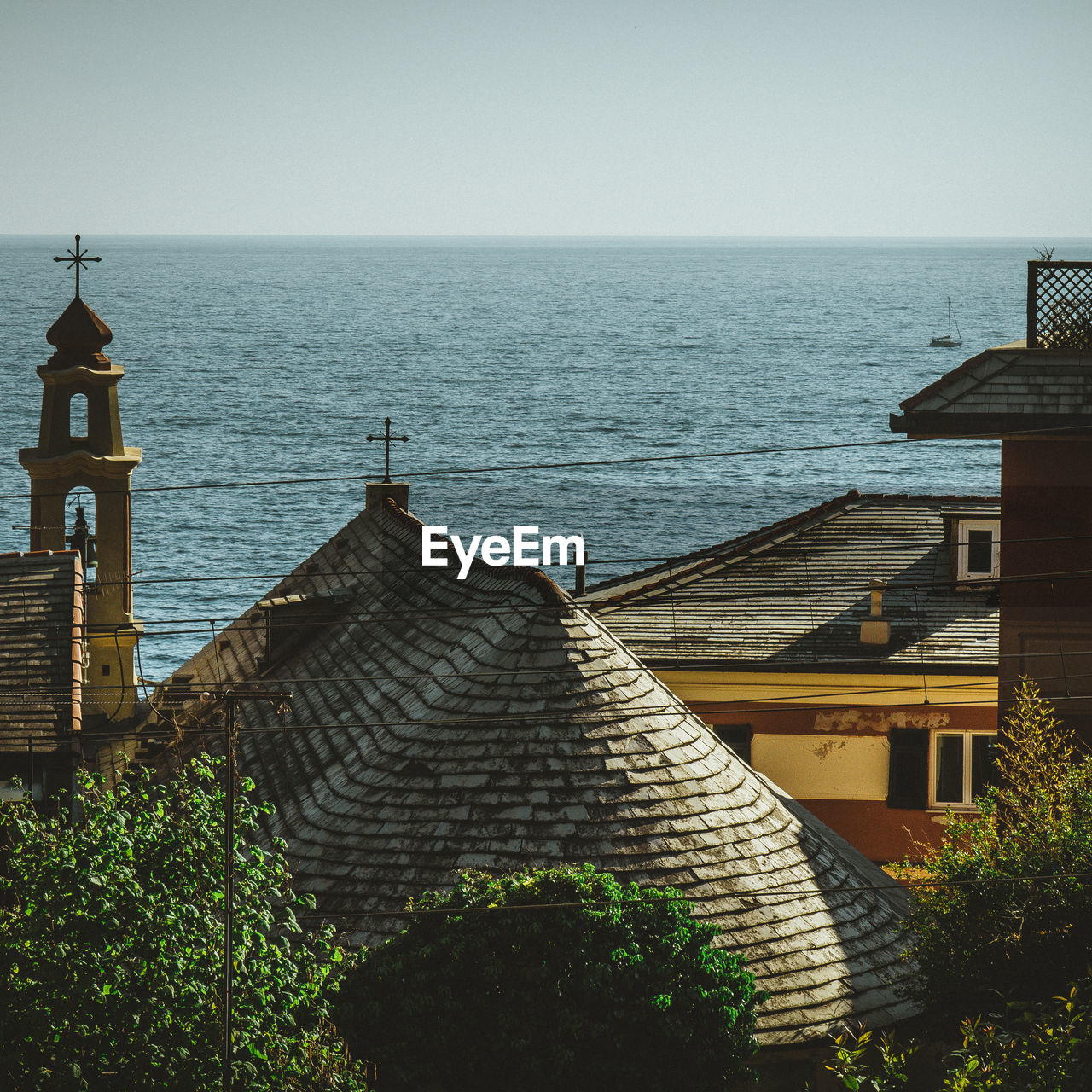 High angle view of church by sea against clear sky