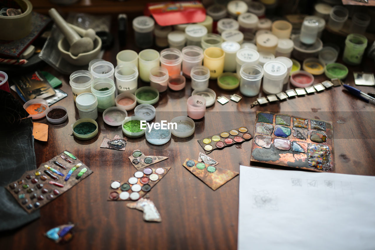 Drawing a sketch on a plate of copper with a metal pen, close-up, materials in a home creative 