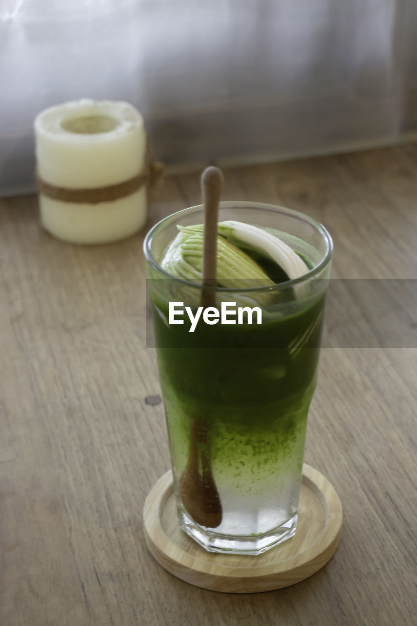 food and drink, food, drink, healthy eating, refreshment, wellbeing, drinking glass, glass, freshness, household equipment, indoors, wood, produce, fruit, table, no people, soft drink, green, close-up, smoothie, drinking straw, vegetable, focus on foreground, still life, straw