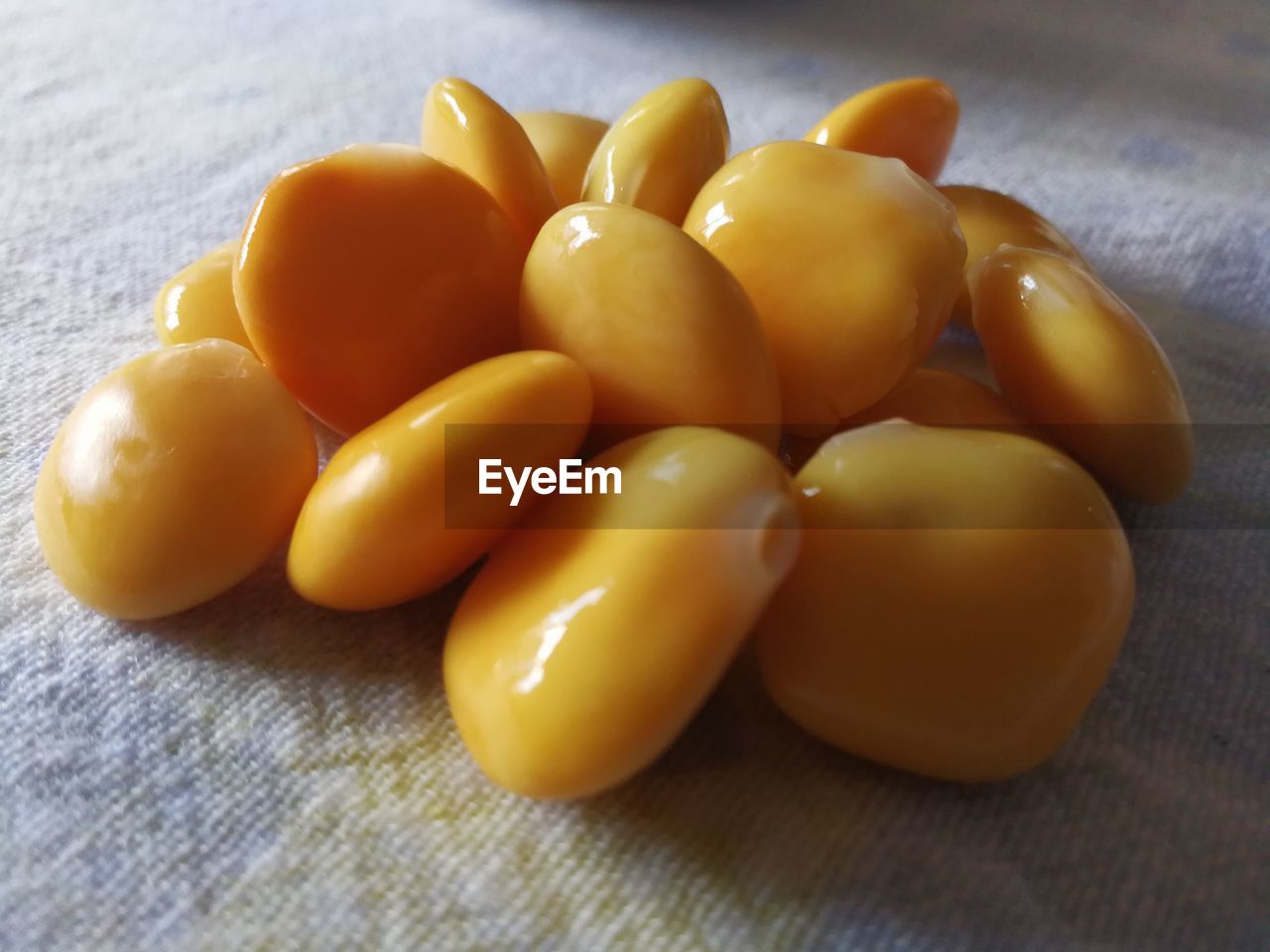 CLOSE-UP OF YELLOW EGGS IN PLATE