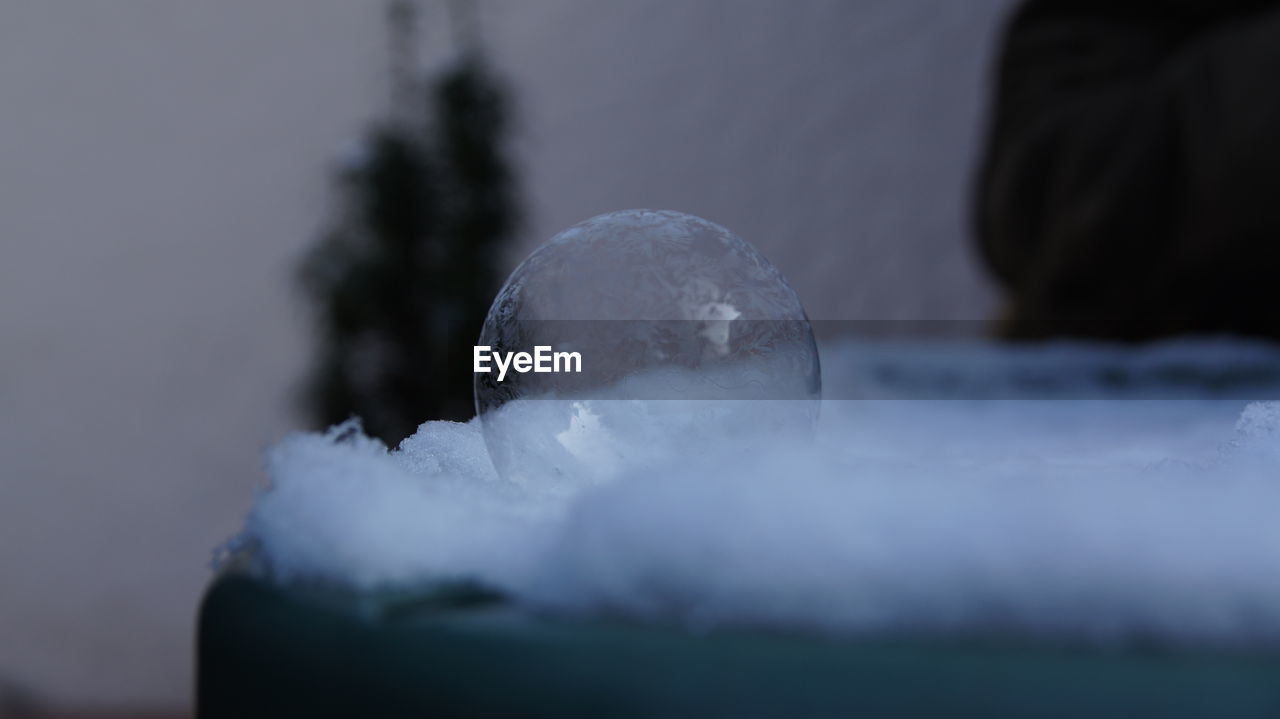 Close-up of frozen bubble on snow