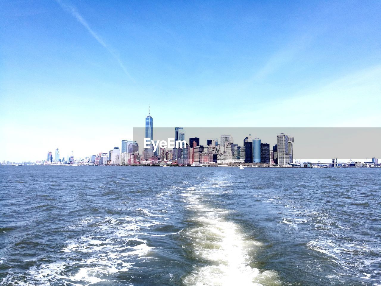 Scenic view of sea and buildings against sky