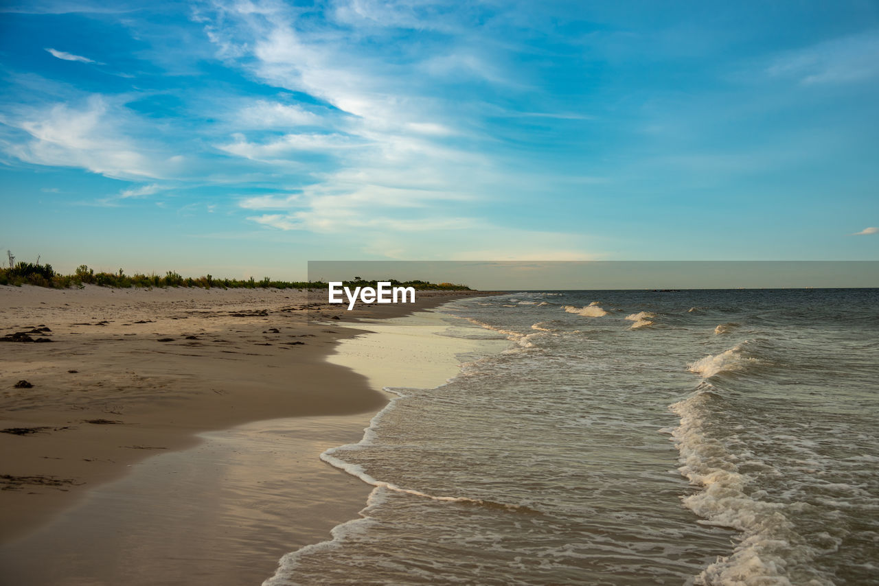 SCENIC VIEW OF SANDY BEACH AGAINST SKY