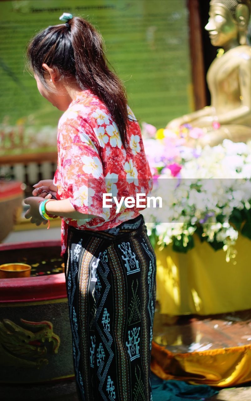 Side view of woman at songkran festival