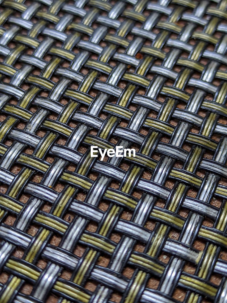 FULL FRAME SHOT OF PATTERNED METAL IN SHELF