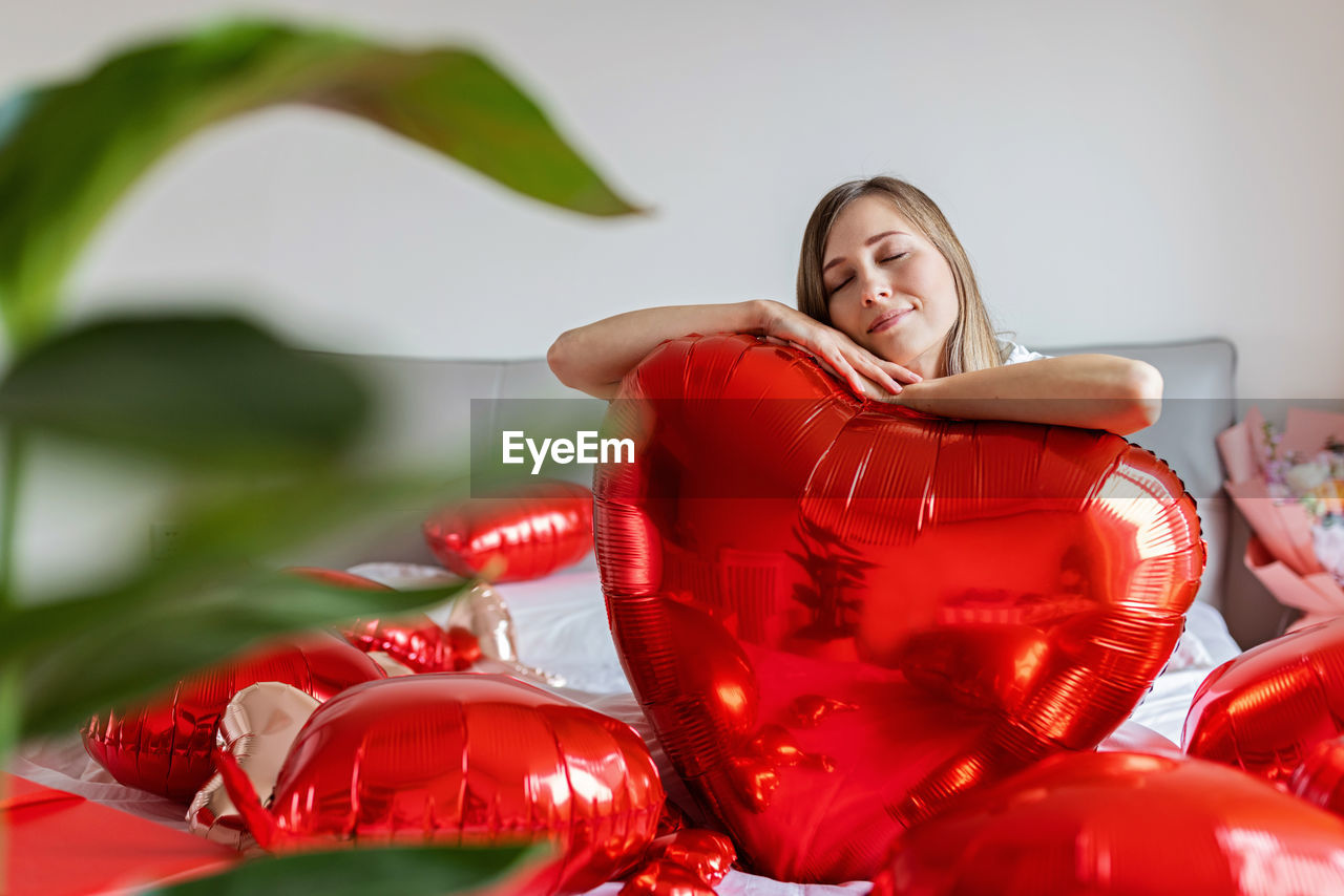 portrait of young woman with heart shape decoration