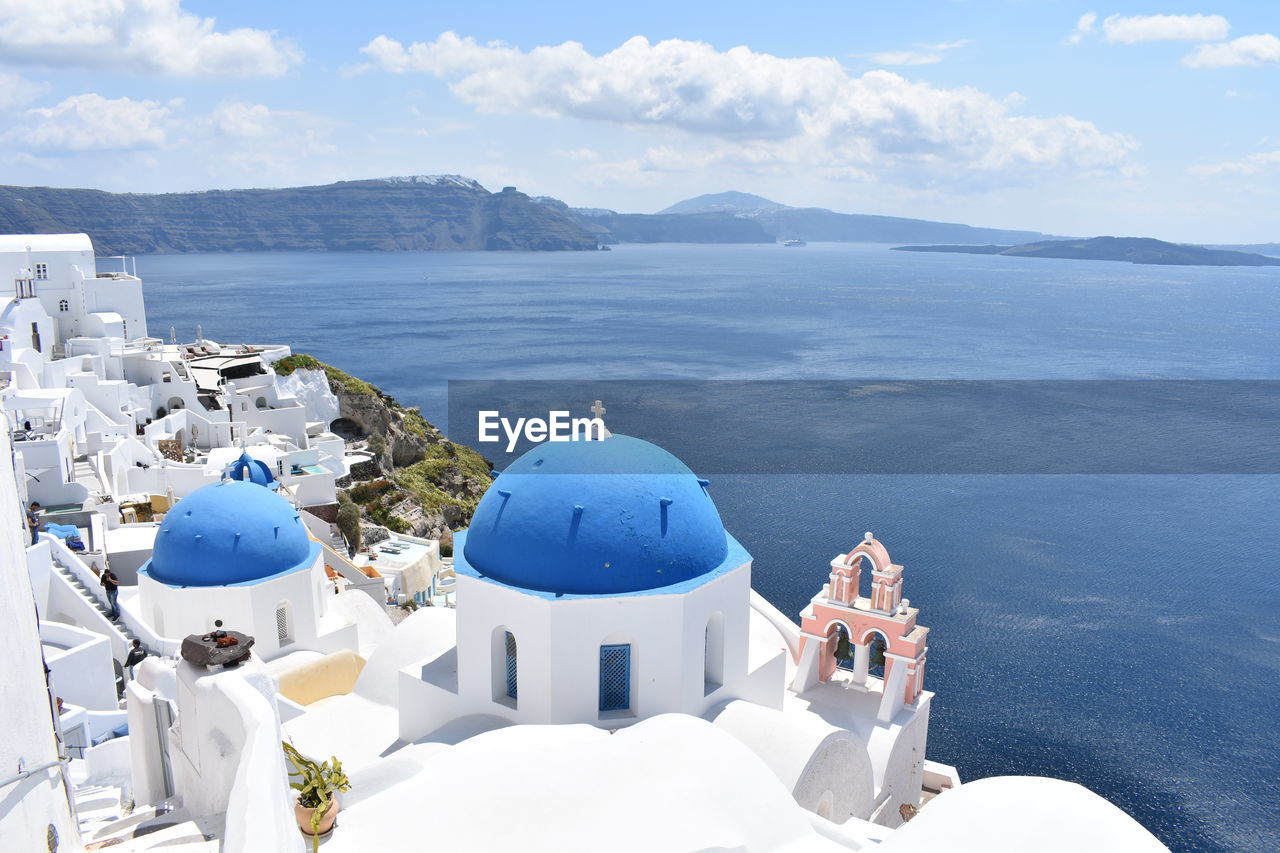 Panoramic view of church and buildings against sky. oia, santorini, greece 