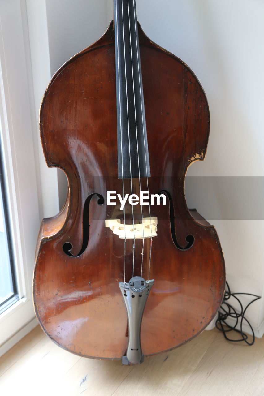 music, musical instrument, arts culture and entertainment, string instrument, viola, bowed string instrument, musical equipment, violin, cello, wood, bass guitar, double bass, indoors, string, classical music, no people, brown, single object, musical instrument string, guitar, violone, close-up