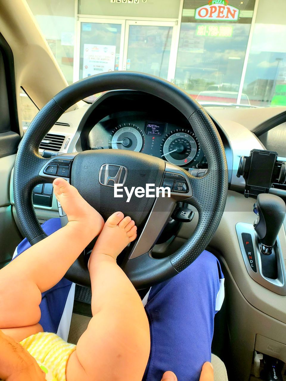 REAR VIEW OF A BOY WITH CAR