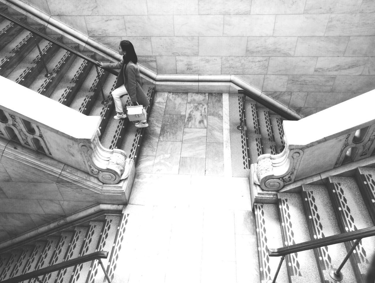 High angle view of woman on staircase