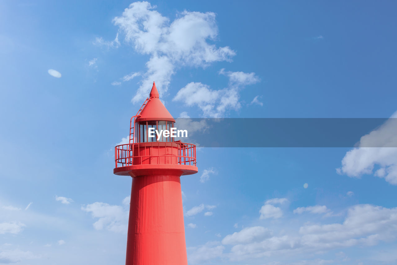 low angle view of lighthouse against cloudy sky