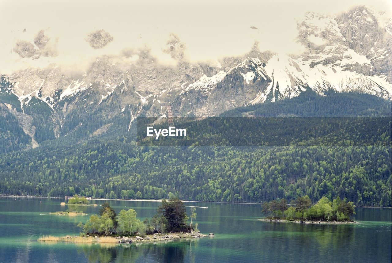 Scenic view of lake against snowcapped mountains