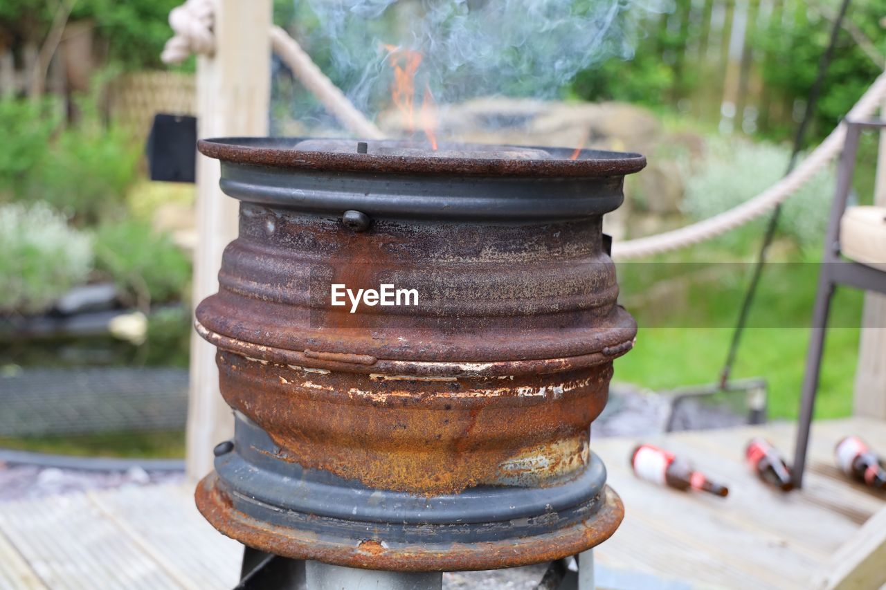 Close-up of old stack of wheels on table at yard