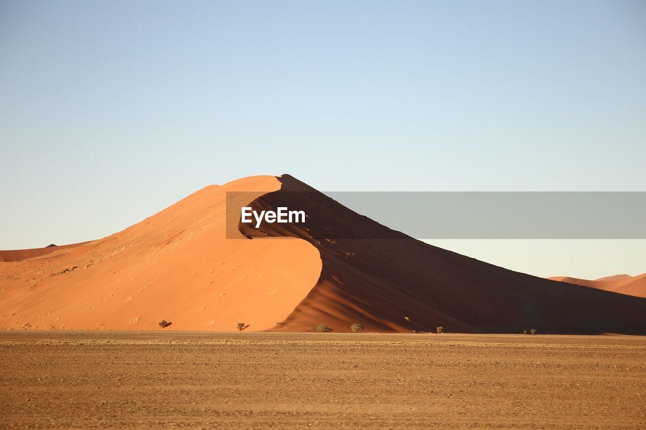 Scenic view of desert against clear sky