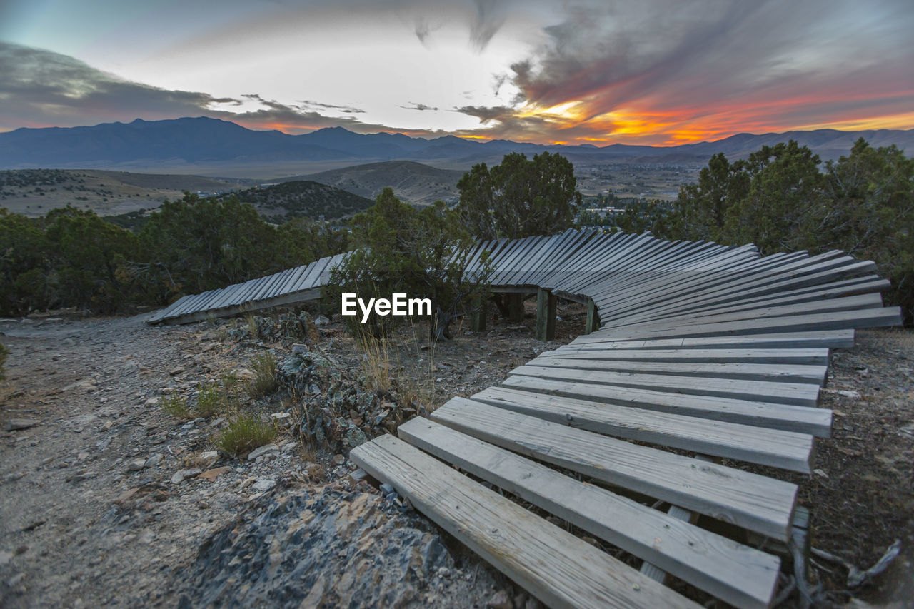 SCENIC VIEW OF LAND AGAINST SKY DURING SUNSET