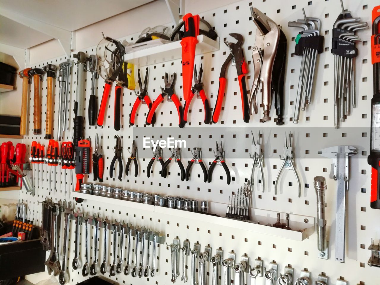 Work tools hanging on wall at workshop