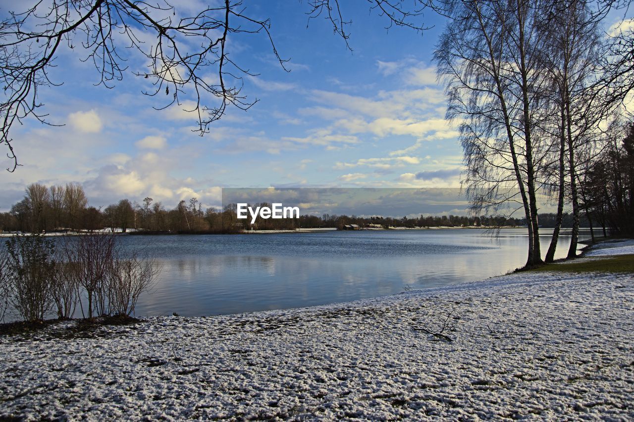 SCENIC VIEW OF LAKE AGAINST SKY DURING WINTER