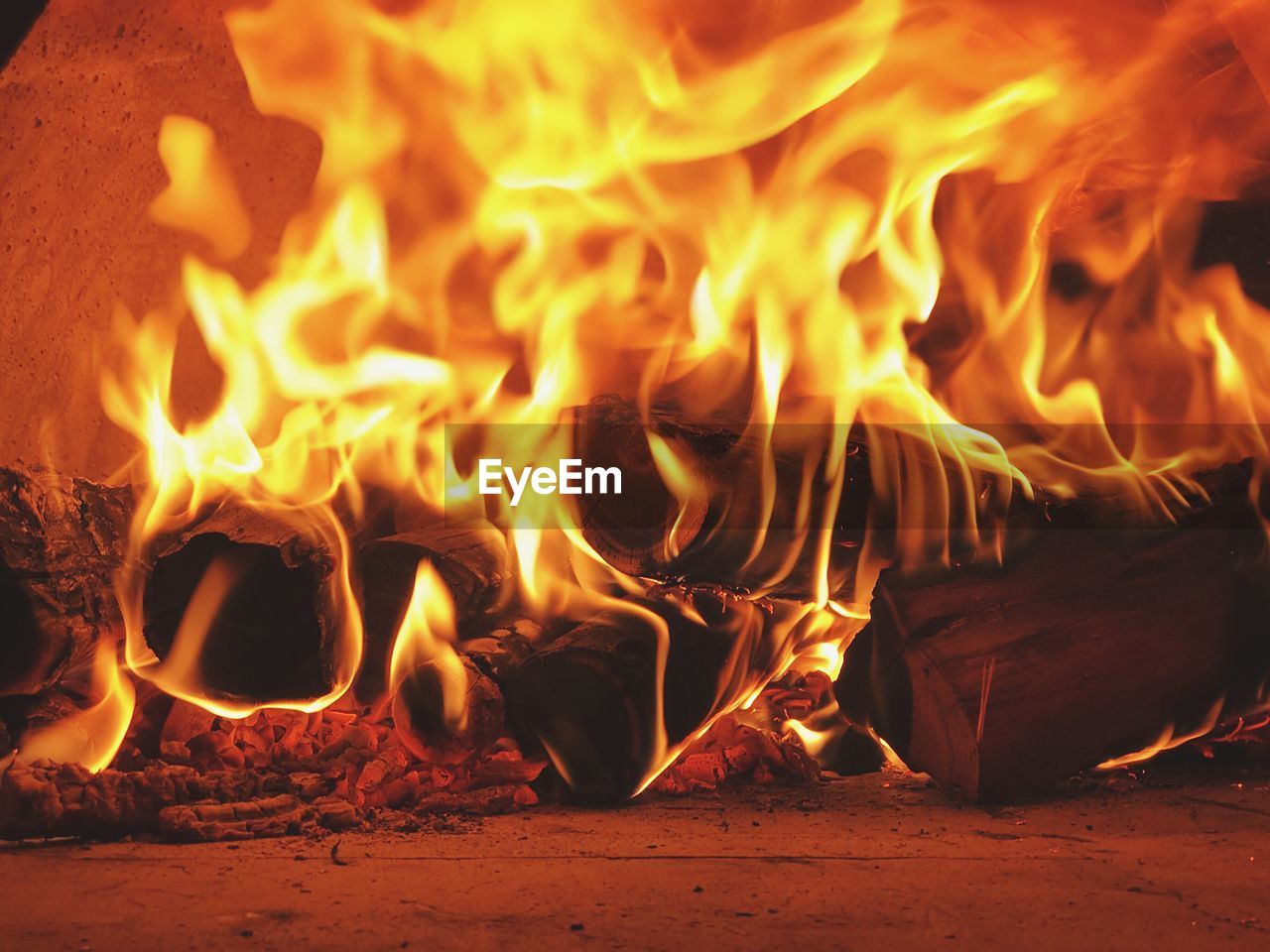 CLOSE-UP OF FIRE BURNING IN THE DARK