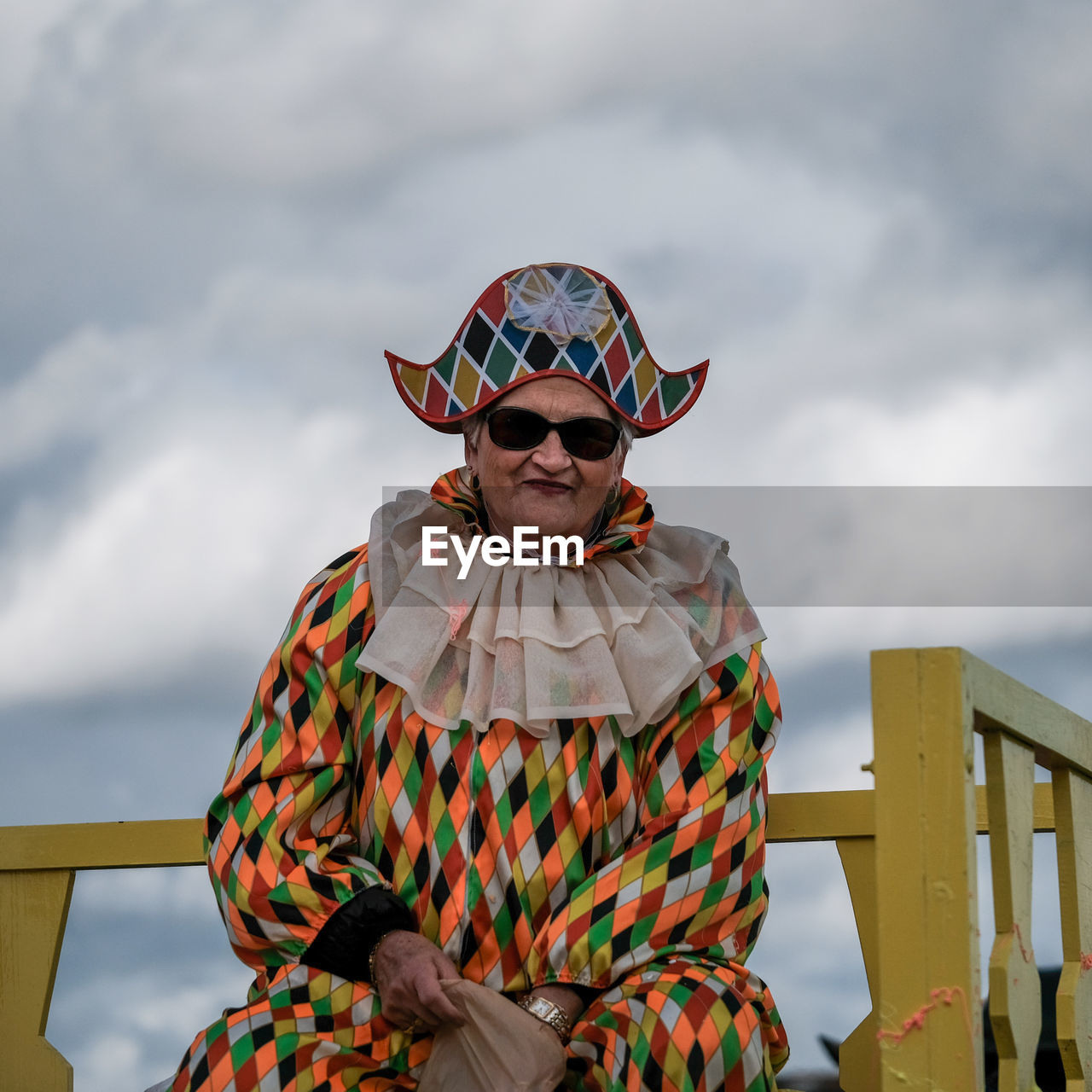 MAN STANDING AGAINST SKY