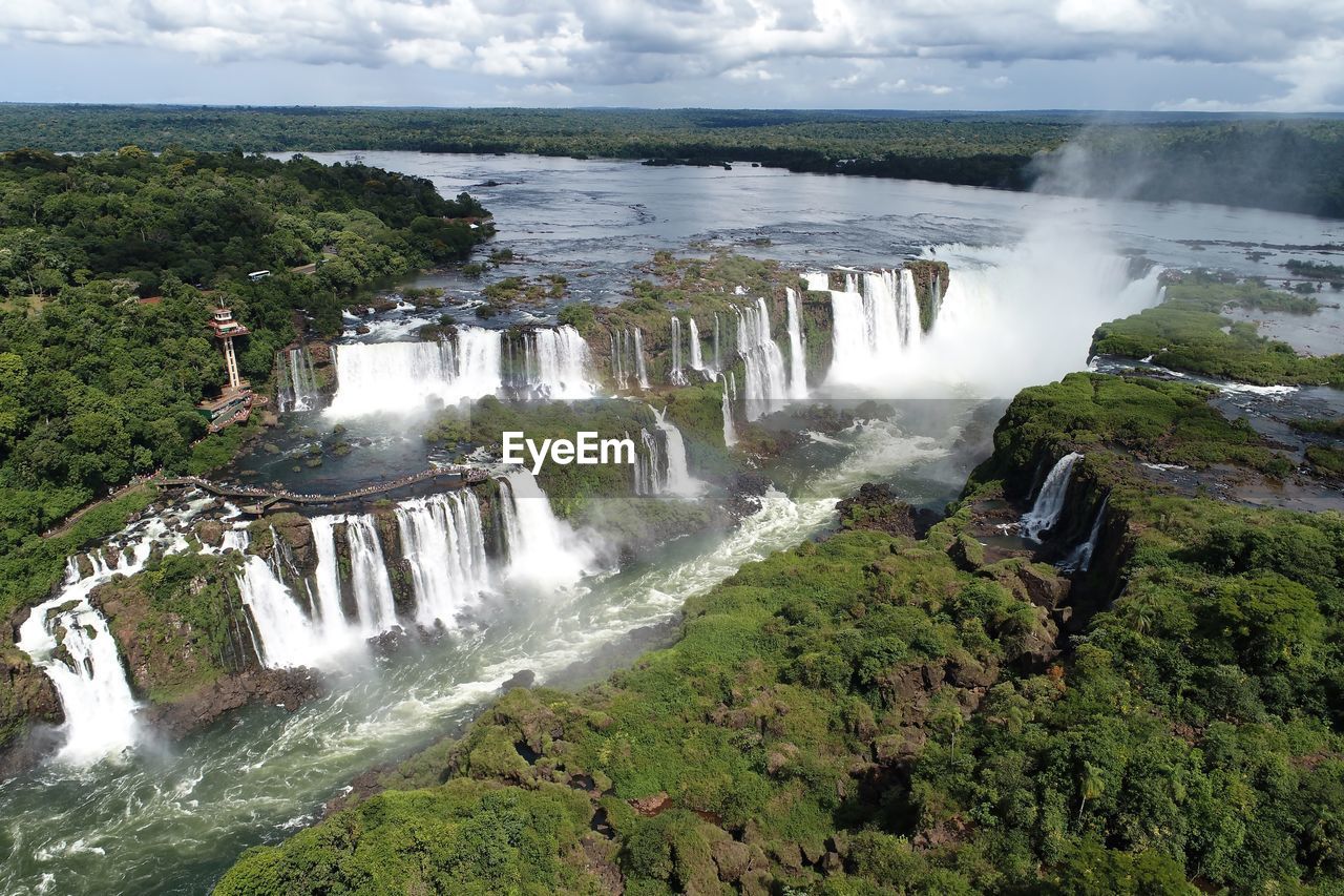 VIEW OF WATERFALL AGAINST SKY