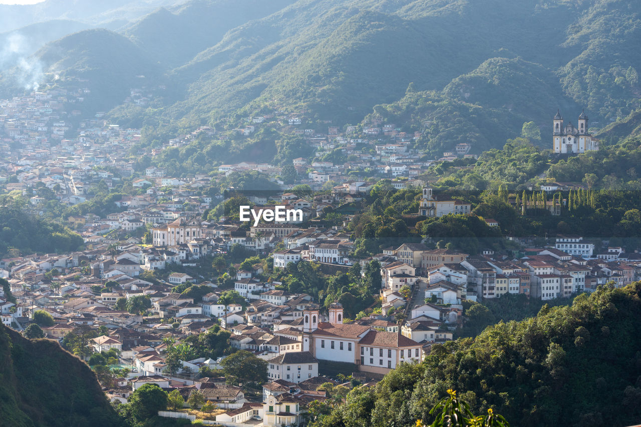 High angle view of townscape and mountains