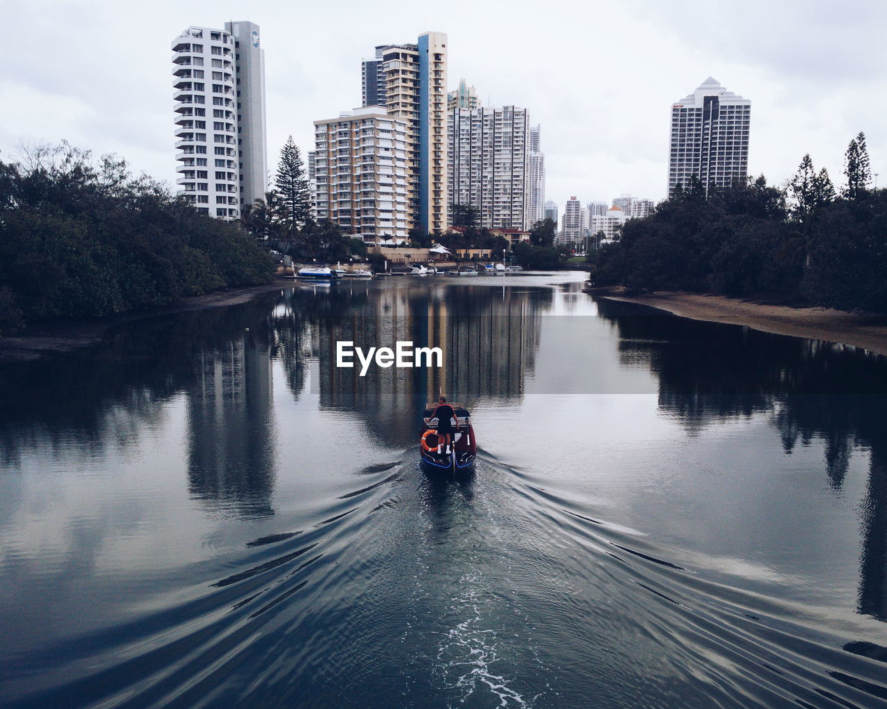 REFLECTION OF BUILDINGS IN WATER