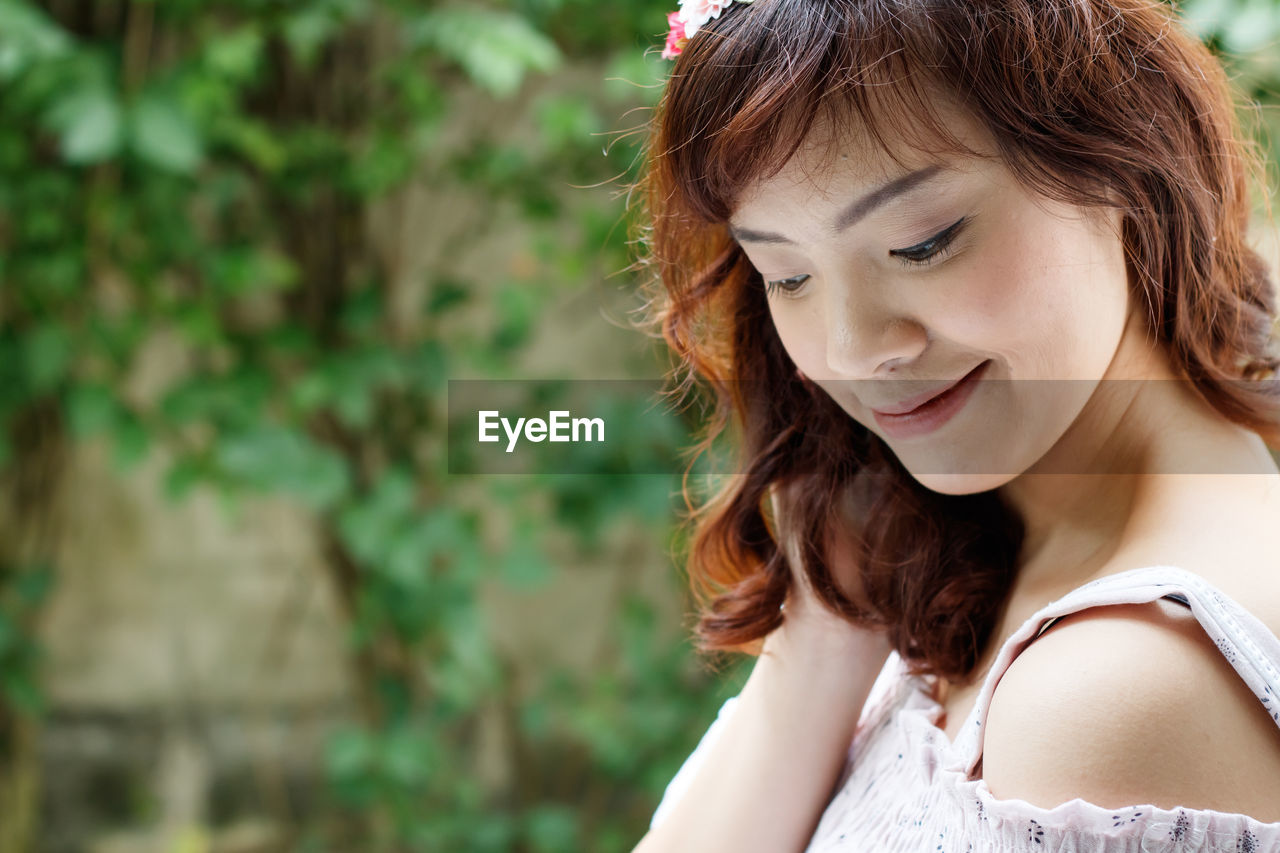 Close-up of smiling young woman