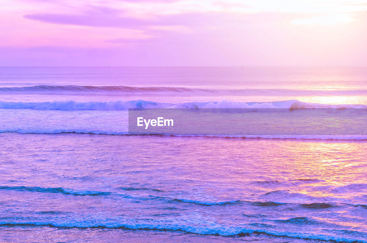 Lilac sunset over the seascape. endless ocean. blurred inspirational calm sea with sunset sky. 