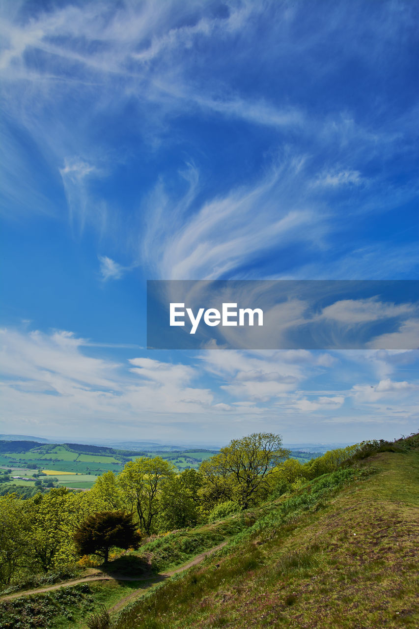 Scenic view of landscape against cloudy sky