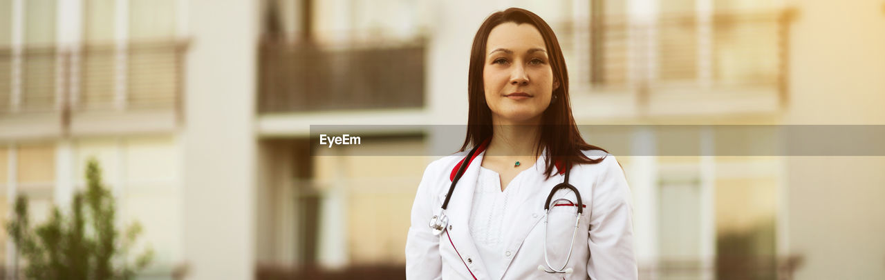 Portrait of doctor standing outdoors