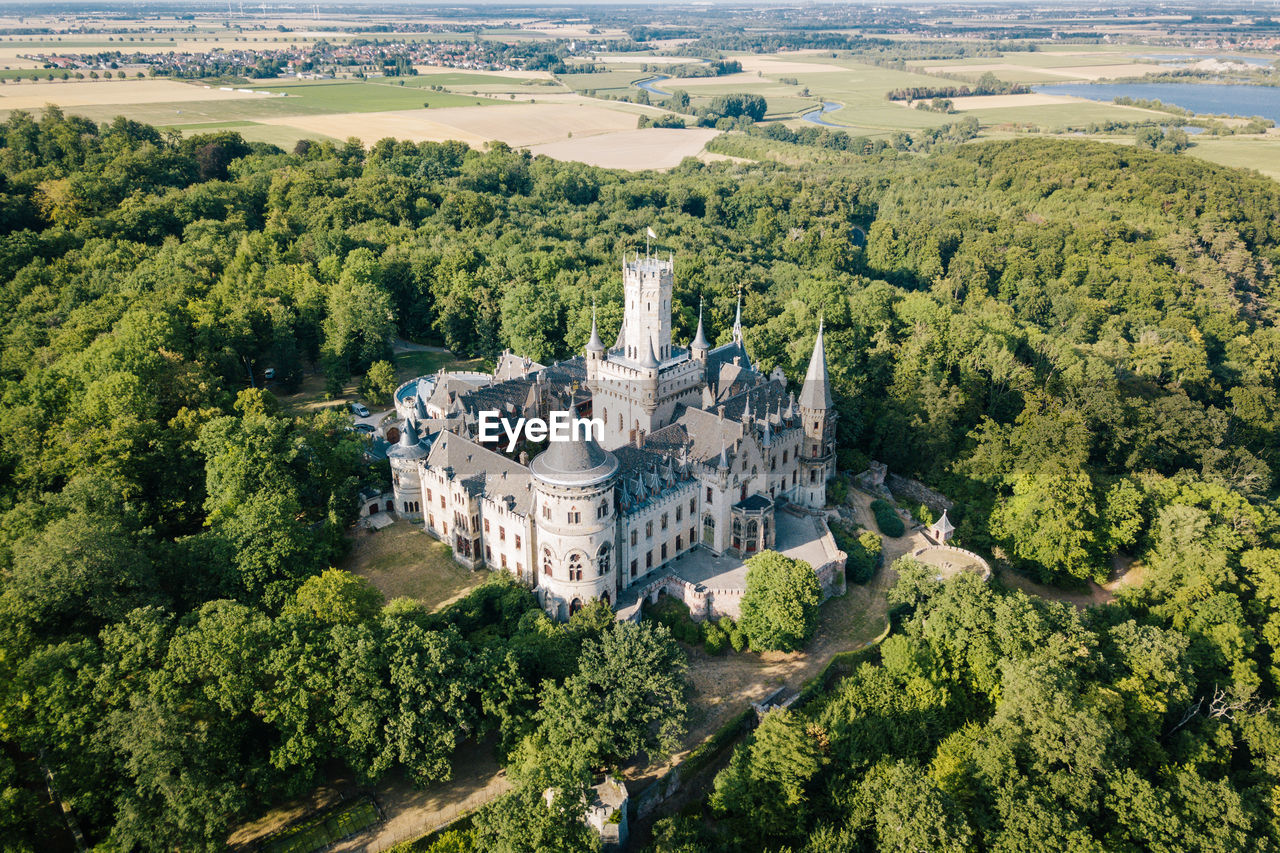 High angle view of marienburg castle amidst trees 